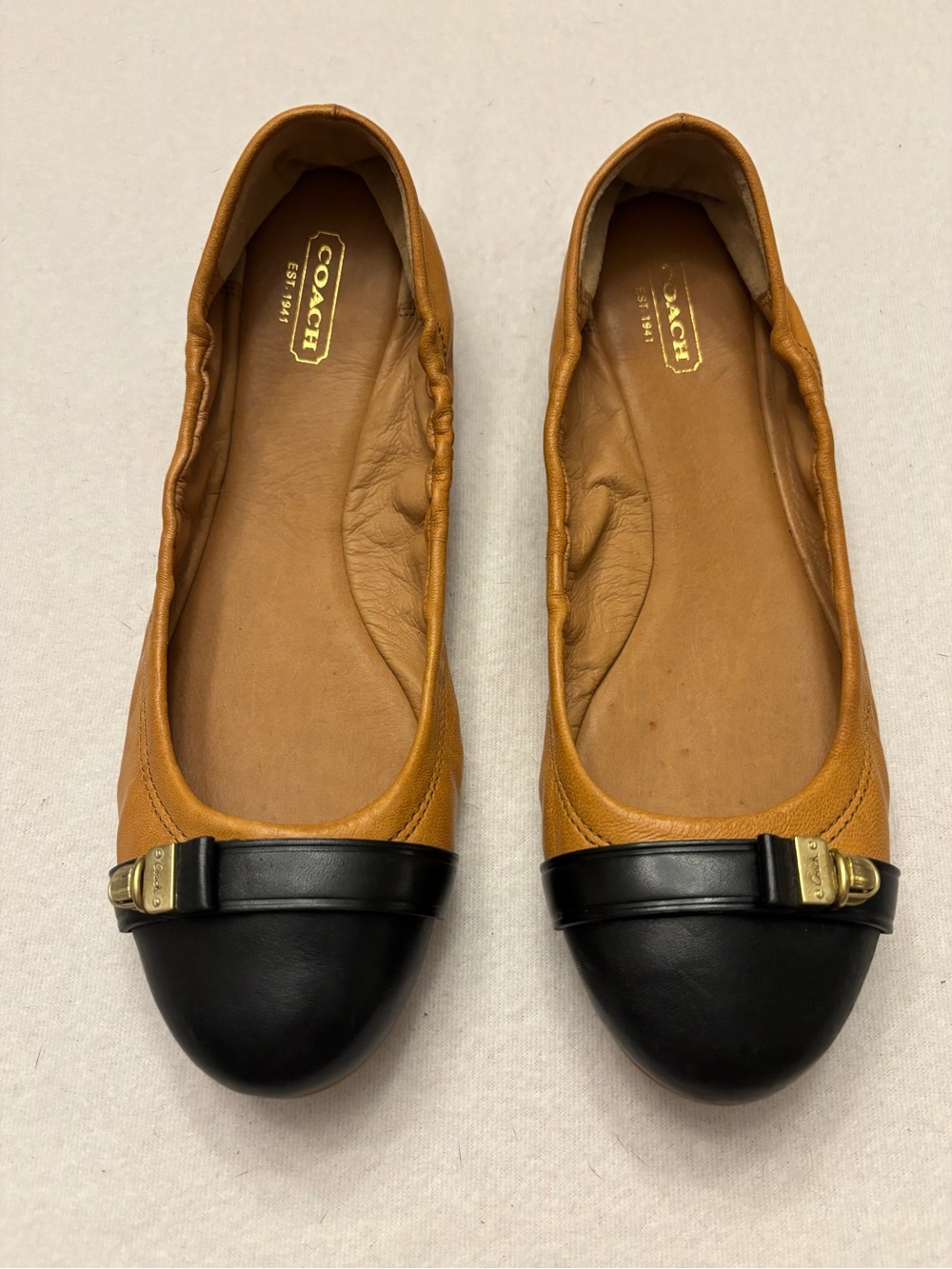 Coach “Delphine” Tan Leather Ballet Flats with Black Cap-Toe & Gold Buckle